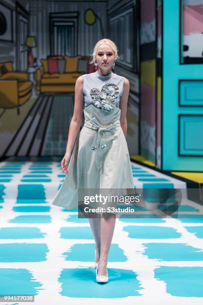 July 09: A model showcases designs by Clarice Lee Check Wing from School of Continuing and Professional Studies, The Chinese University of Hong Kong...