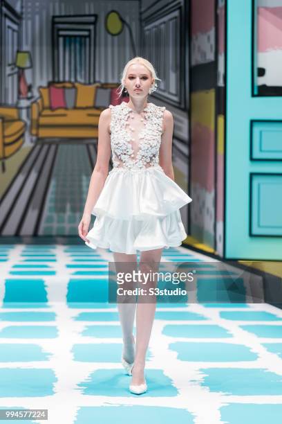 July 09: A model showcases designs by Anson Yu Tsun Kit from School of Continuing and Professional Studies, The Chinese University of Hong Kong...