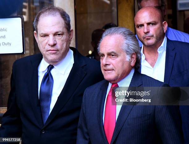 Harvey Weinstein, former co-chairman of the Weinstein Co., left, exits from state supreme court with attorney Benjamin Brafman in New York, U.S., on...