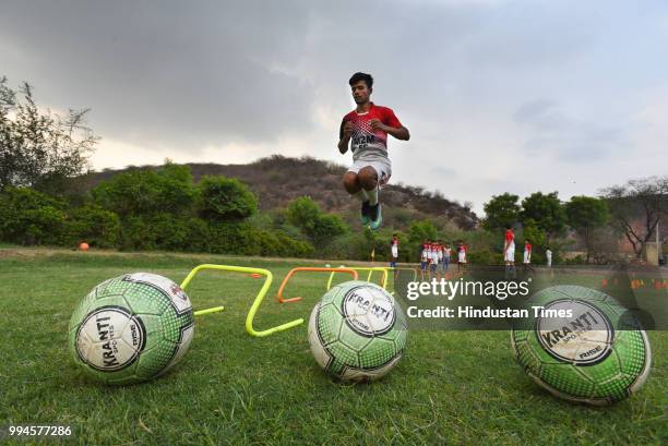 Member of the M2M football club practices in a park at Ghamroj Village on June 27, 2018 near Gurugram, India. Once a cricket crazy village near...