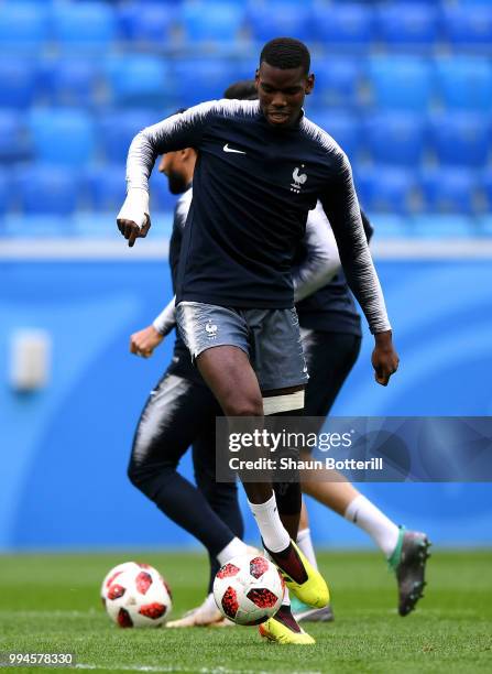 Paul Pogba of France runs with the ball during a France Training Session at Saint Petersburg Stadium on July 9, 2018 in Saint Petersburg, Russia.