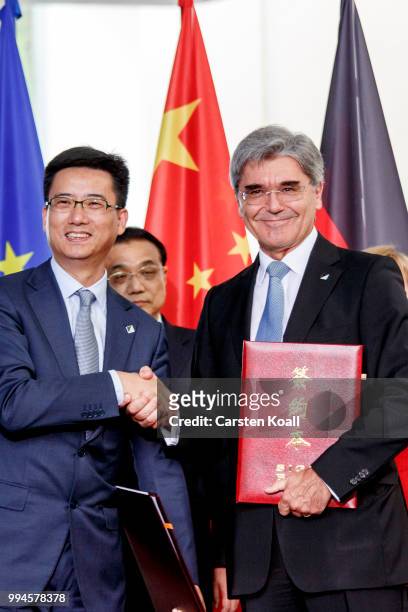 Joe Kaesner , CEO of Siemens AG and Simon Hu Head of Alibaba Cloud Computing Co.Ltd., sign a contract in the Chancellory on July 9, 2018 in Berlin,...
