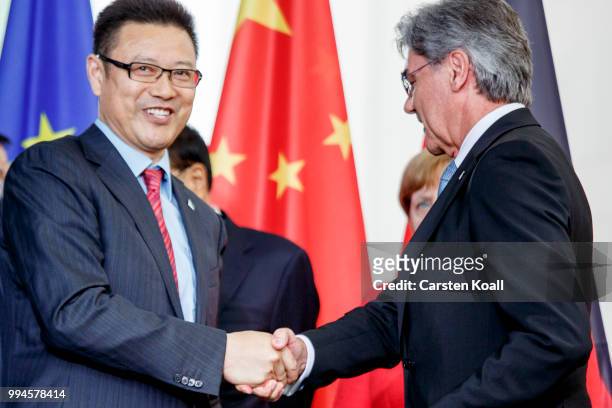 Joe Kaesner , CEO of Siemens AG and Simon Hu Head of Alibaba Cloud Computing Co.Ltd., sign a contract in the Chancellory on July 9, 2018 in Berlin,...