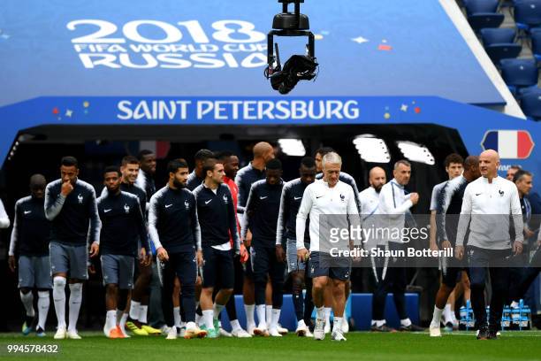 Didier Deschamps, Manager of France leads his team out onto the pitch during a France Training Session at Saint Petersburg Stadium on July 9, 2018 in...