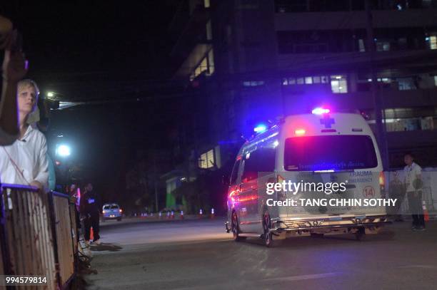 An ambulance transporting alleged members of the children's football team approaches the hospital in the northern Thai city of Chiang Rai on July 9,...