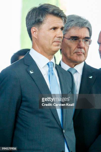 Harald Krueger , CEO of German BMW and Joe Kaesner , CEO of Siemens AG, attend a contract signing ceremony in the Chancellory on July 9, 2018 in...