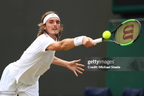 Stefanos Tsitsipas of Greece plays a shot against John Isner of the United States during their Men's Singles fourth round match on day seven of the...