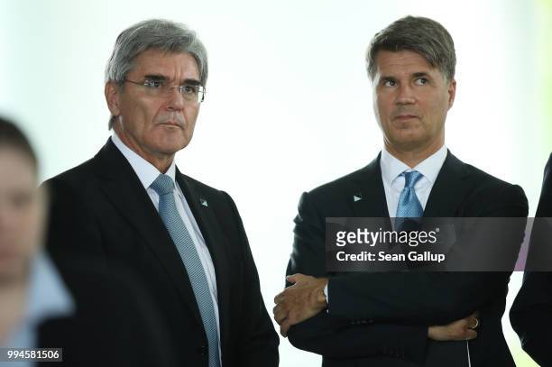 Joe Kaeser , CEO of Siemens AG, and Harald Krueger, Chairman of BMW, attend a signing ceremenony of joint documents of intent between German and...