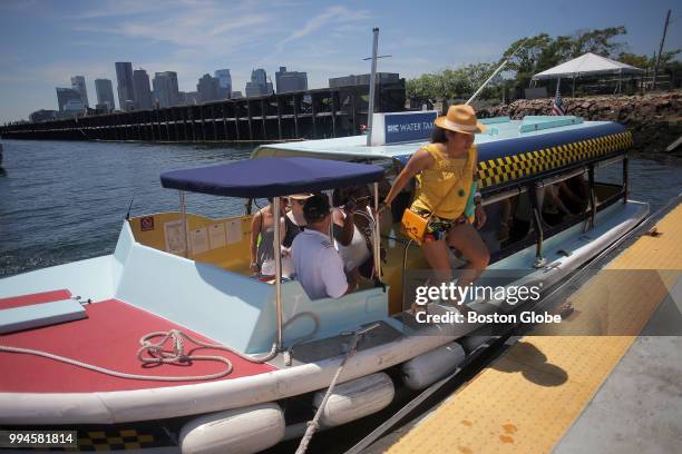 Patrons of the Institute of Contemporary Art, Boston exit the water shuttle over to East Boston to visit the museum's new gallery space on July 4,...
