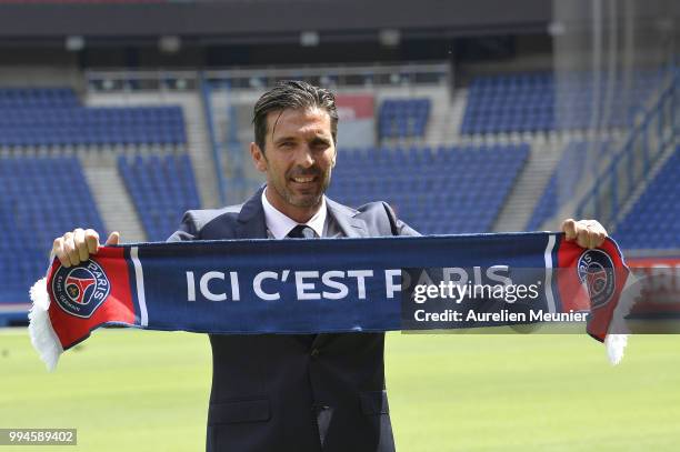 Gianluigi Buffon poses after signing with the Paris Saint-Germain Football Club at Parc des Princes on July 9, 2018 in Paris, France. Buffon signed...