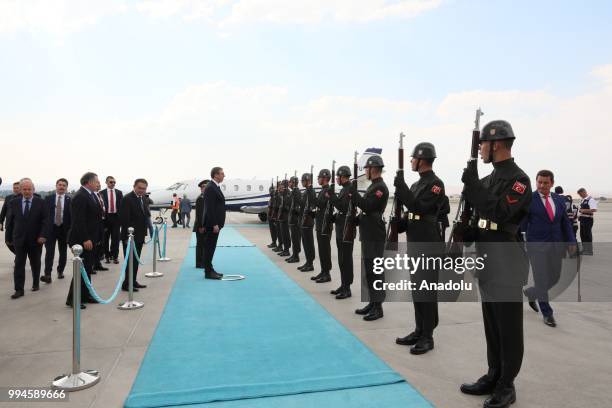 Serbian President Aleksandar Vucic is welcomed by Turkish Youth and Sports Minister Osman Askin Bak after his arrival at Esenboga Airport in Ankara,...