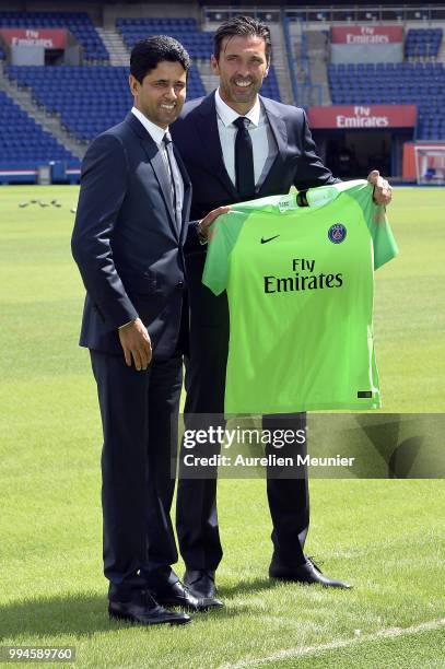 Gianluigi Buffon and Paris Saint-Germain President Nasser Al Khelaifi pose after signing with the Paris Saint-Germain Football Club at Parc des...