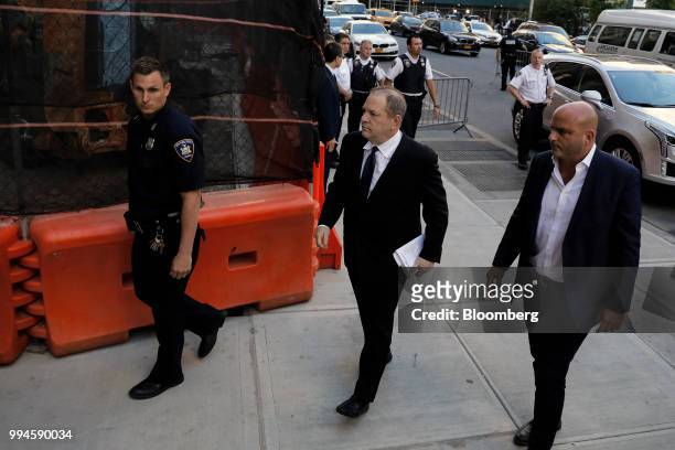 Harvey Weinstein, former co-chairman of the Weinstein Co., center, arrives to state supreme court in New York, U.S., on Monday, July 9, 2018....