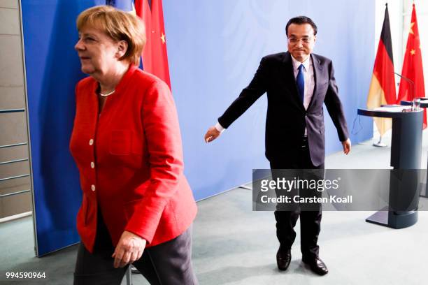 German Chancellor Angela Merkel and Chinese Premier Li Keqiang leave a press conference following Germany-China government consultations on July 9,...