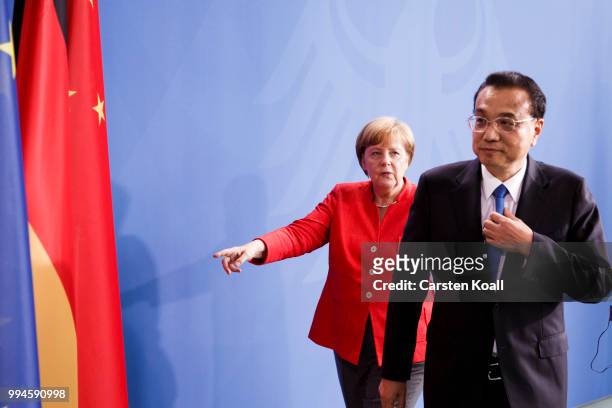 German Chancellor Angela Merkel and Chinese Premier Li Keqiang leave a press conference following Germany-China government consultations on July 9,...