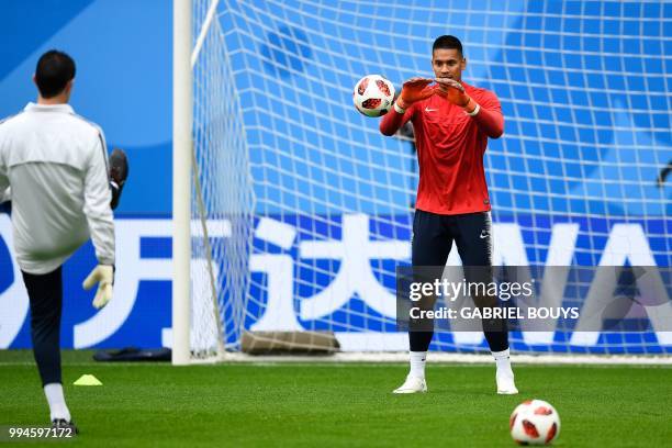 France's goalkeeper Alphonse Areola prepares to stop the ball during a training session of France's national football team at the Saint Petersburg...