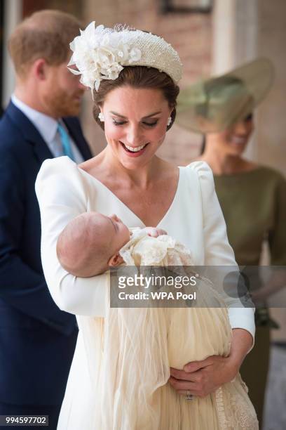Catherine, Duchess of Cambridge carries Prince Louis as they arrive for his christening service at St James's Palace on July 09, 2018 in London,...