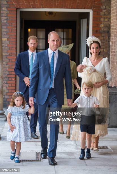 Princess Charlotte and Prince George hold the hands of their father, Prince William, Duke of Cambridge, as they arrive at the Chapel Royal, St...