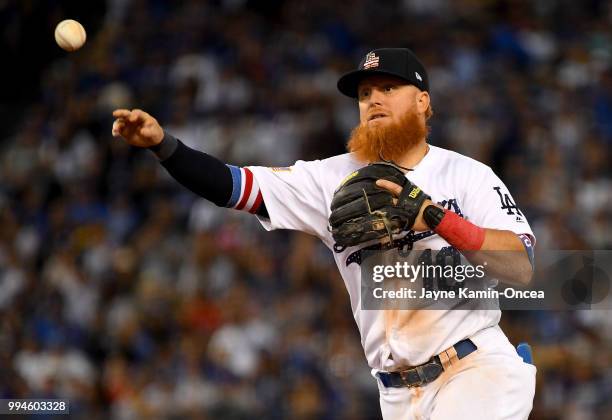 Justin Turner of the Los Angeles Dodgers makes a play in the game against the Pittsburgh Pirates at Dodger Stadium on July 4, 2018 in Los Angeles,...
