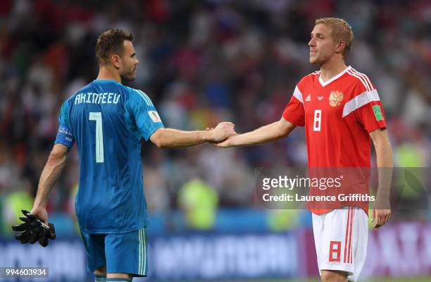 Igor Akinfeev of Russia consoles Iury Gazinsky after defeat in the 2018 FIFA World Cup Russia Quarter Final match between Russia and Croatia at Fisht...