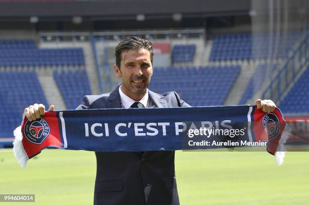 Gianluigi Buffon poses after signing with the Paris Saint-Germain Football Club at Parc des Princes on July 9, 2018 in Paris, France. Buffon signed...