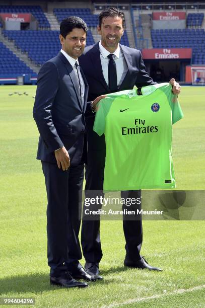 Gianluigi Buffon and Paris Saint-Germain President Nasser Al Khelaifi pose after signing with the Paris Saint-Germain Football Club at Parc des...