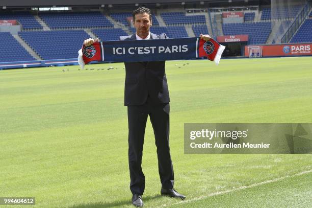 Gianluigi Buffon poses after signing with the Paris Saint-Germain Football Club at Parc des Princes on July 9, 2018 in Paris, France. Buffon signed...