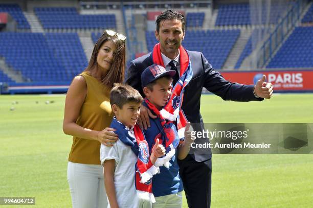 Gianluigi Buffon and his companion Ilaria D'Amico pose after signing with the Paris Saint-Germain Football Club at Parc des Princes on July 9, 2018...