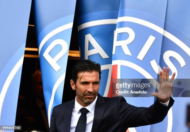 Paris Saint Germain's new goalkeeper Gianluigi Buffon poses after his official presentation press conference at Parc des Princes stadium in Paris,...