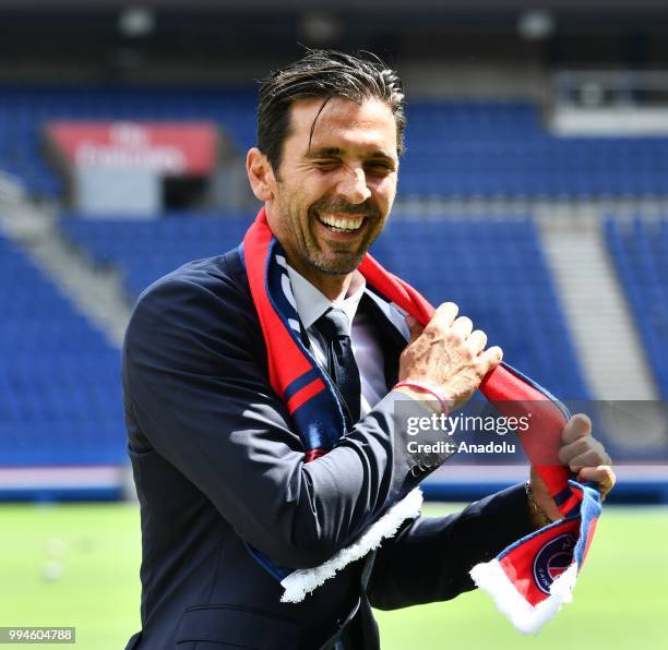 Paris Saint Germain's new goalkeeper Gianluigi Buffon poses after his official presentation press conference at Parc des Princes stadium in Paris,...