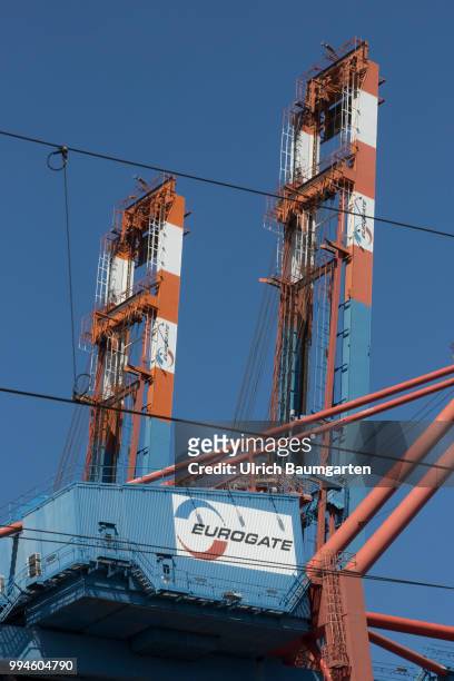Gateway to the world - the container port in Hamburg. Eurogate loading cranes with the Eurogate logo.