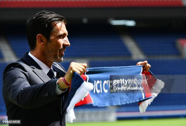 Paris Saint Germain's new goalkeeper Gianluigi Buffon poses after his official presentation press conference at Parc des Princes stadium in Paris,...