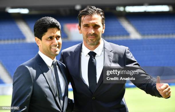 Paris Saint Germain's new goalkeeper Gianluigi Buffon and PSG's president Nasser Al-Khelaifi pose after official presentation press conference at...