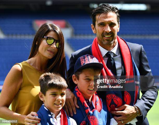 Paris Saint Germain's new goalkeeper Gianluigi Buffon poses after his official presentation press conference with his wife Alena Seredova , his sons...