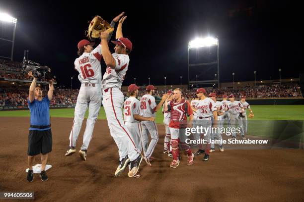 Blaine Knight and Dominic Fletcher of the Arkansas Razorbacks celebrate their win over the Oregon State Beavers during the Division I Men's Baseball...