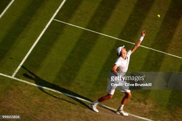 Kevin Anderson of South Africa serves against Gael Monfils of France during their Men's Singles fourth round match on day seven of the Wimbledon Lawn...