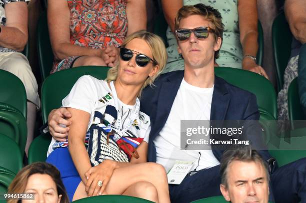 Poppy Delevingne and her husband James Cook attend day seven of the Wimbledon Tennis Championships at the All England Lawn Tennis and Croquet Club on...