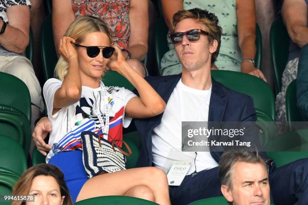 Poppy Delevingne and her husband James Cook attend day seven of the Wimbledon Tennis Championships at the All England Lawn Tennis and Croquet Club on...