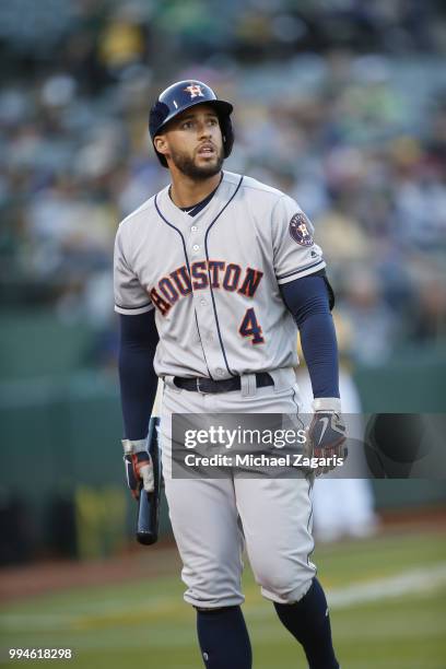 George Springer of the Houston Astros stands on the field during the game against the Oakland Athletics at the Oakland Alameda Coliseum on June 12,...