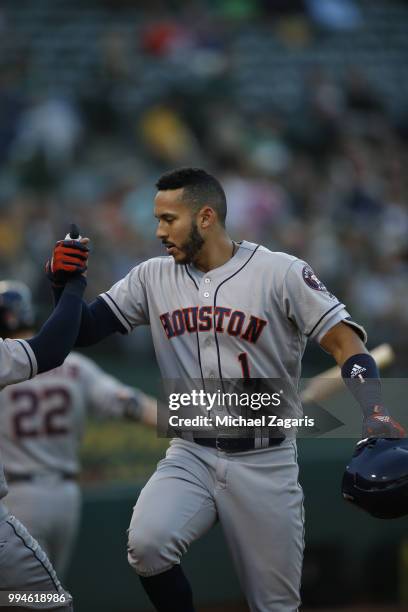 Carlos Correa of the Houston Astros celebrates after hitting a home run during the game against the Oakland Athletics at the Oakland Alameda Coliseum...