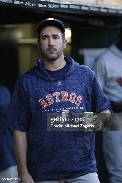 Justin Verlander of the Houston Astros stands in the dugout during the game against the Oakland Athletics at the Oakland Alameda Coliseum on June 12,...