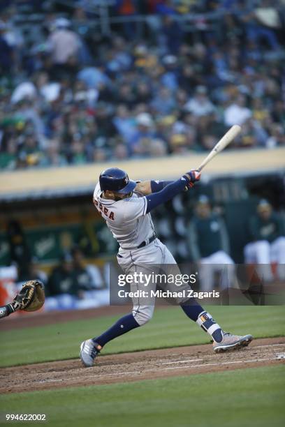 Carlos Correa of the Houston Astros bats during the game against the Oakland Athletics at the Oakland Alameda Coliseum on June 12, 2018 in Oakland,...