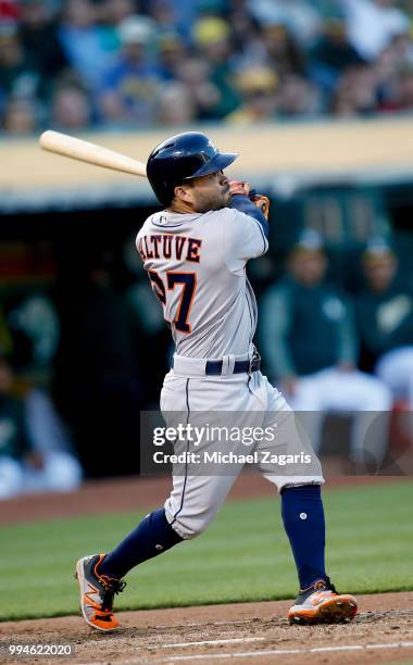 Jose Altuve of the Houston Astros bats during the game against the Oakland Athletics at the Oakland Alameda Coliseum on June 12, 2018 in Oakland,...