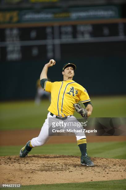 Daniel Mengden of the Oakland Athletics pitches during the game against the Houston Astros at the Oakland Alameda Coliseum on June 12, 2018 in...