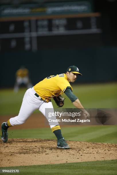 Daniel Mengden of the Oakland Athletics pitches during the game against the Houston Astros at the Oakland Alameda Coliseum on June 12, 2018 in...