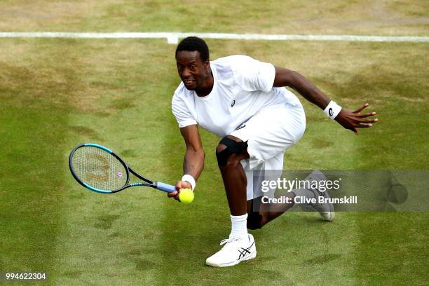 Gael Monfils of France plays a forehand against Kevin Anderson of South Africa during their Men's Singles fourth round match on day seven of the...