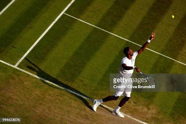 Gael Monfils of France serves against Kevin Anderson of South Africa during their Men's Singles fourth round match on day seven of the Wimbledon Lawn...
