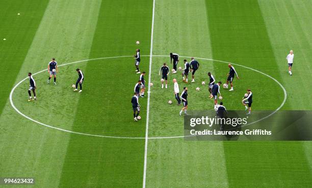 The France team warm up in the centre circle during a training session at Saint Petersburg Stadium on July 9, 2018 in Saint Petersburg, Russia.