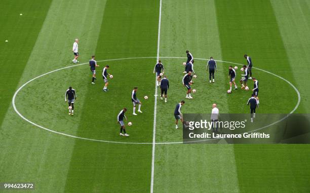 The France team warm up in the centre circle during a training session at Saint Petersburg Stadium on July 9, 2018 in Saint Petersburg, Russia.