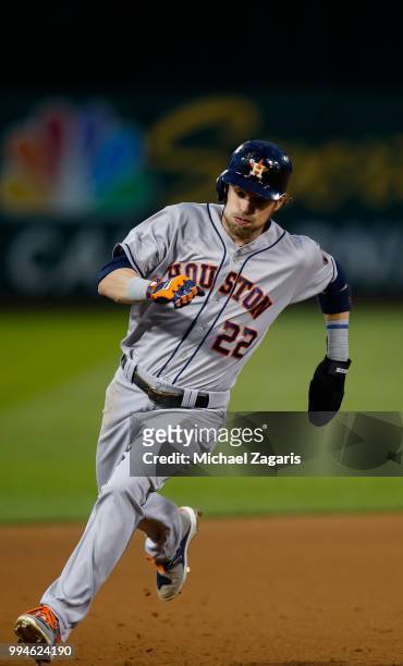 Josh Reddick of the Houston Astros runs the bases during the game against the Oakland Athletics at the Oakland Alameda Coliseum on June 12, 2018 in...